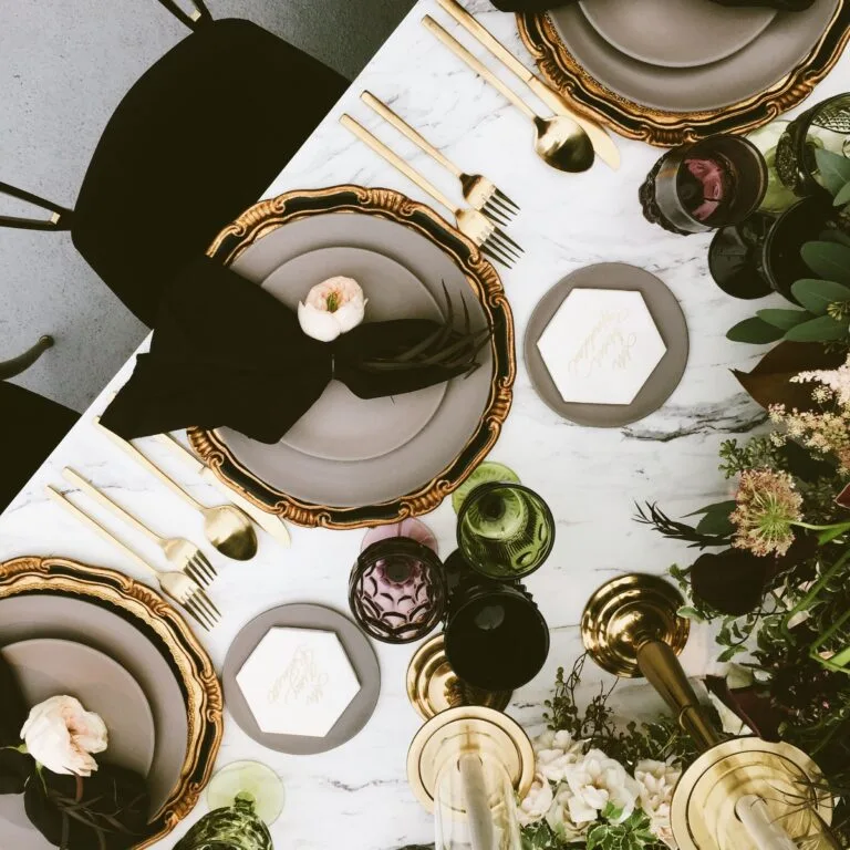 Overhead gold and black place settings