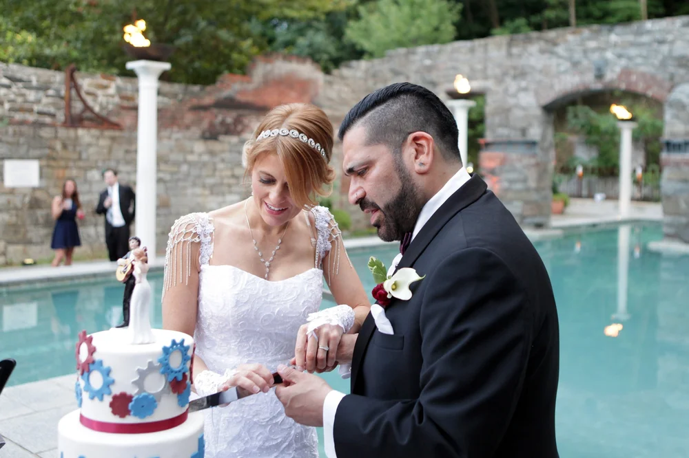 Couple cutting the cake together