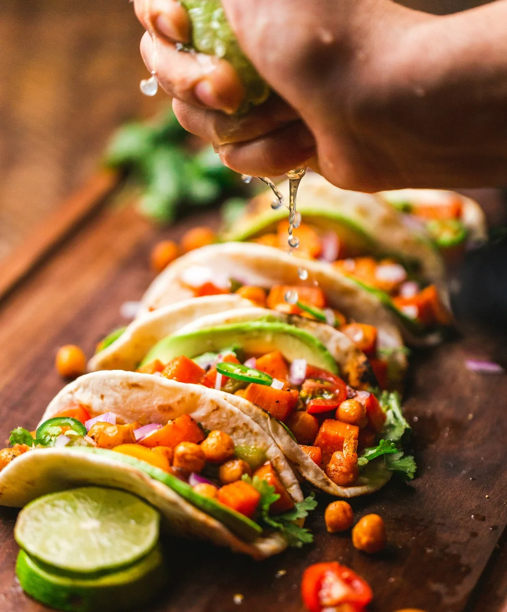 Chef plating food at a catering station during an event