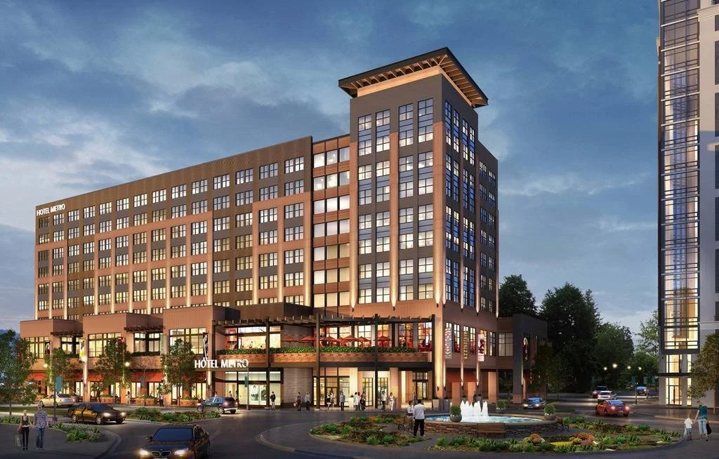 Exterior rendering of a modern hotel and retail building at sunset