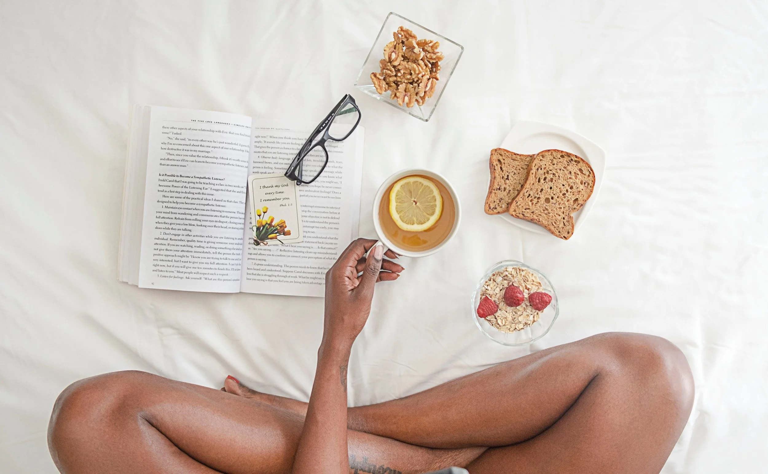 Bride relaxing and reading a book enjoying a stress-free planning experience.