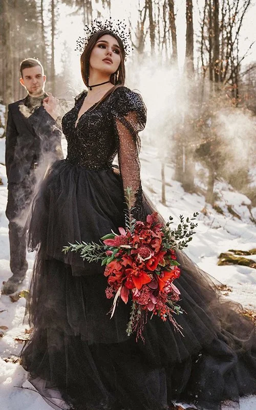 Black wedding gown on a glowing bride for a moody inspired wedding look