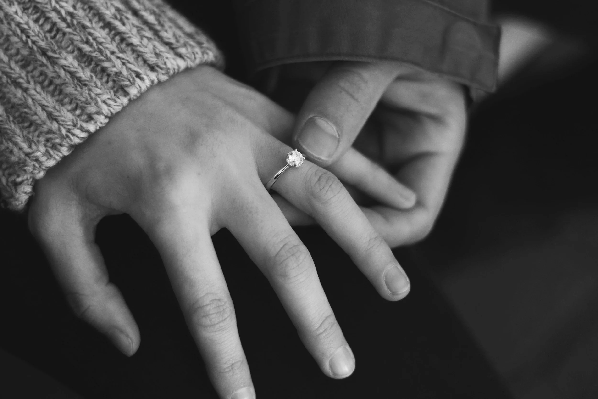 Engaged couple showing off ring