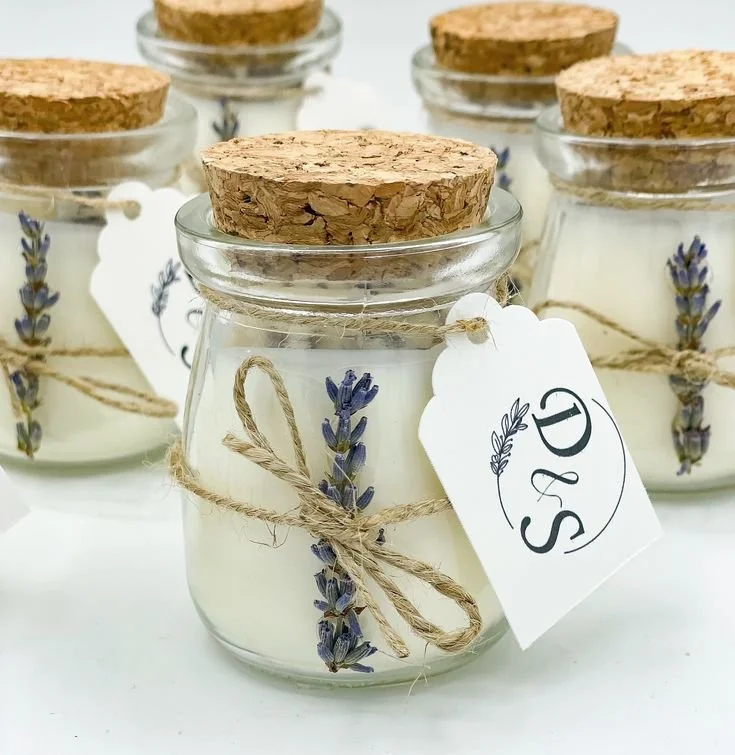 Lavender candle favours in glass jars with cork lids and kraft tags