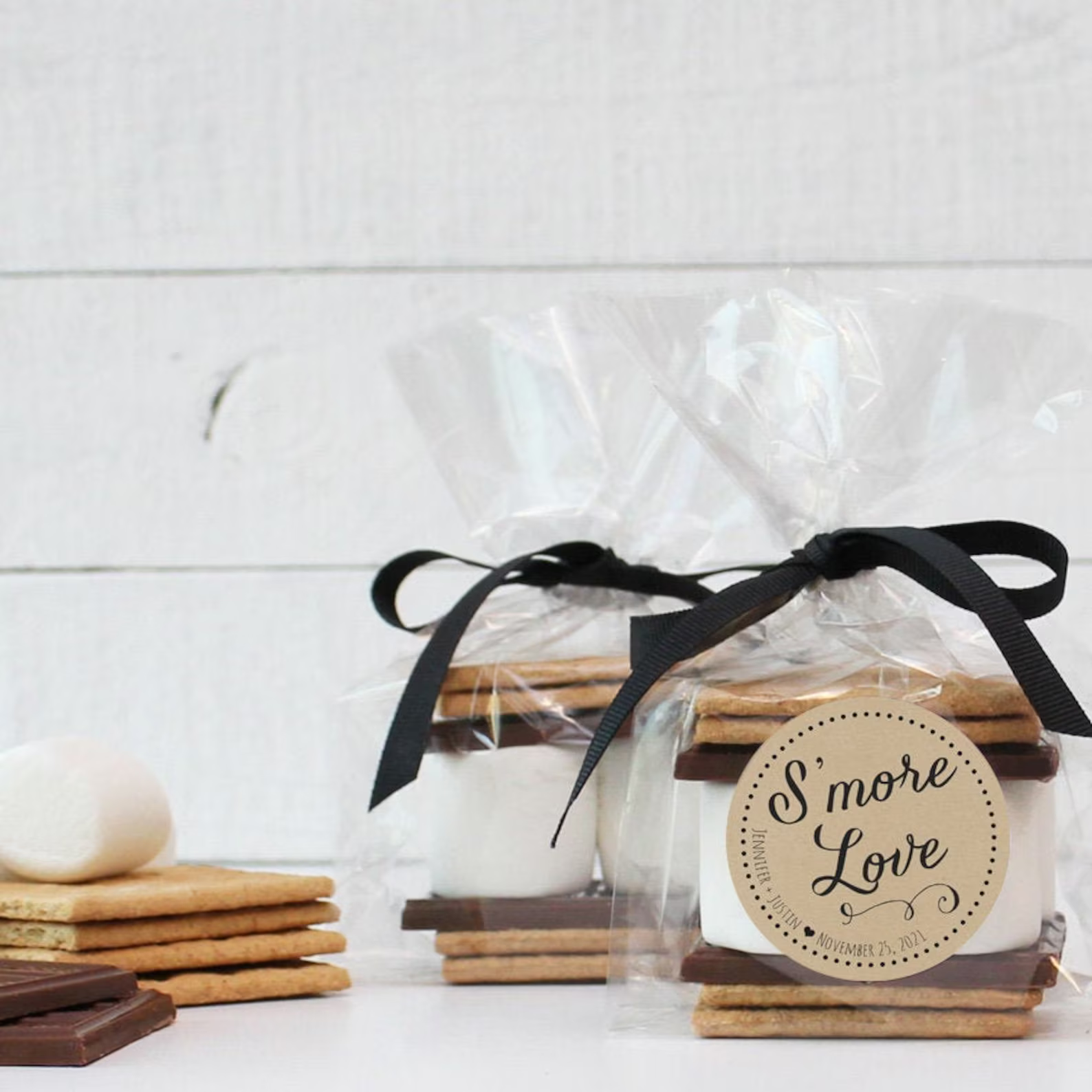 S'mores kit wedding favour tied with a black ribbon and a kraft tag