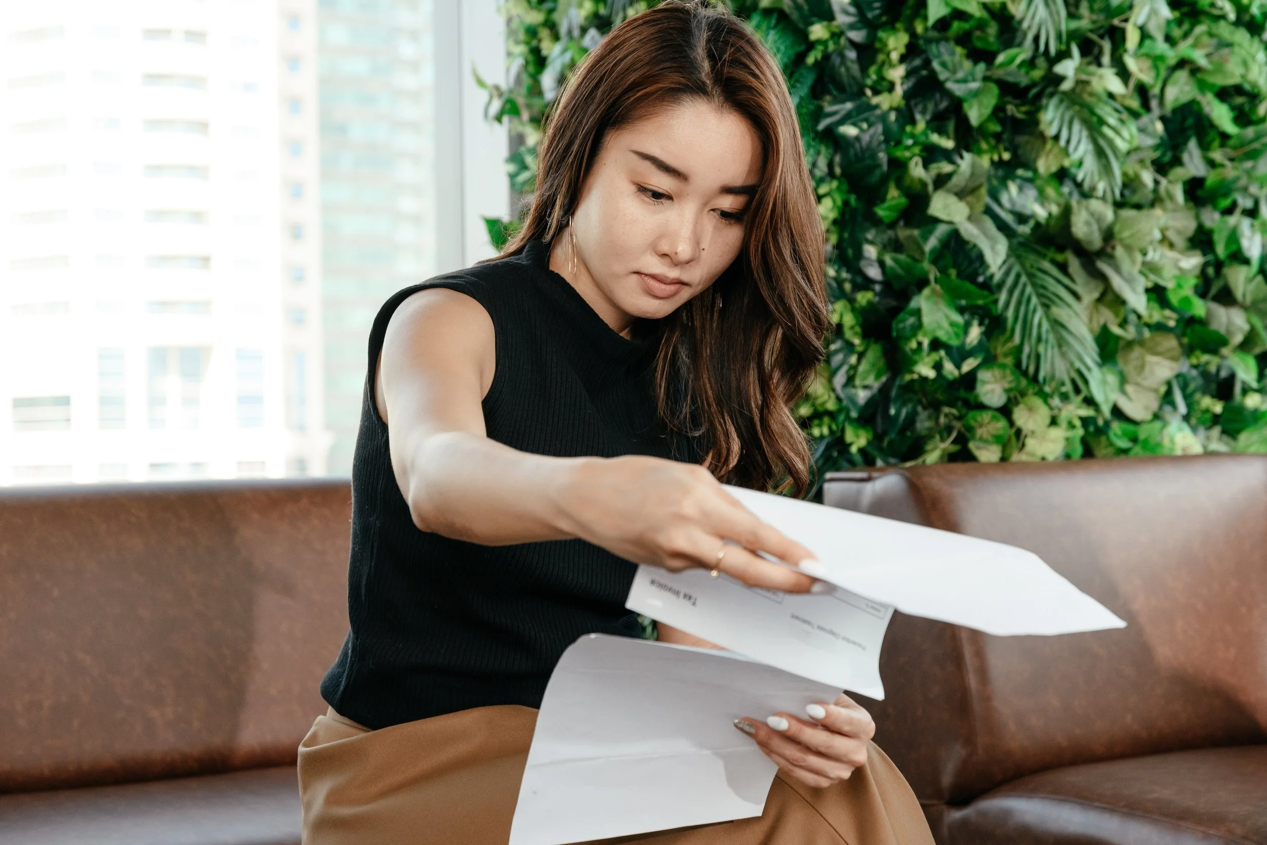 Bride with Planner: A bride discussing plans with a professional wedding planner.