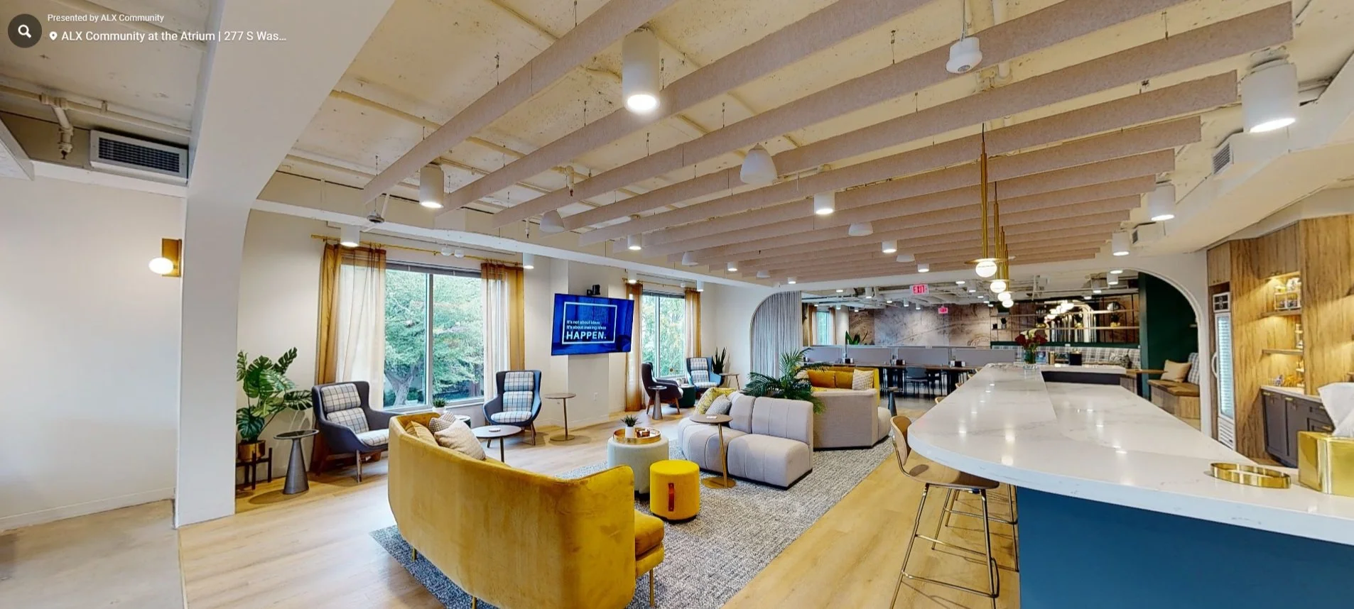 Contemporary lounge venue with a mustard velvet sofa and exposed timber ceiling