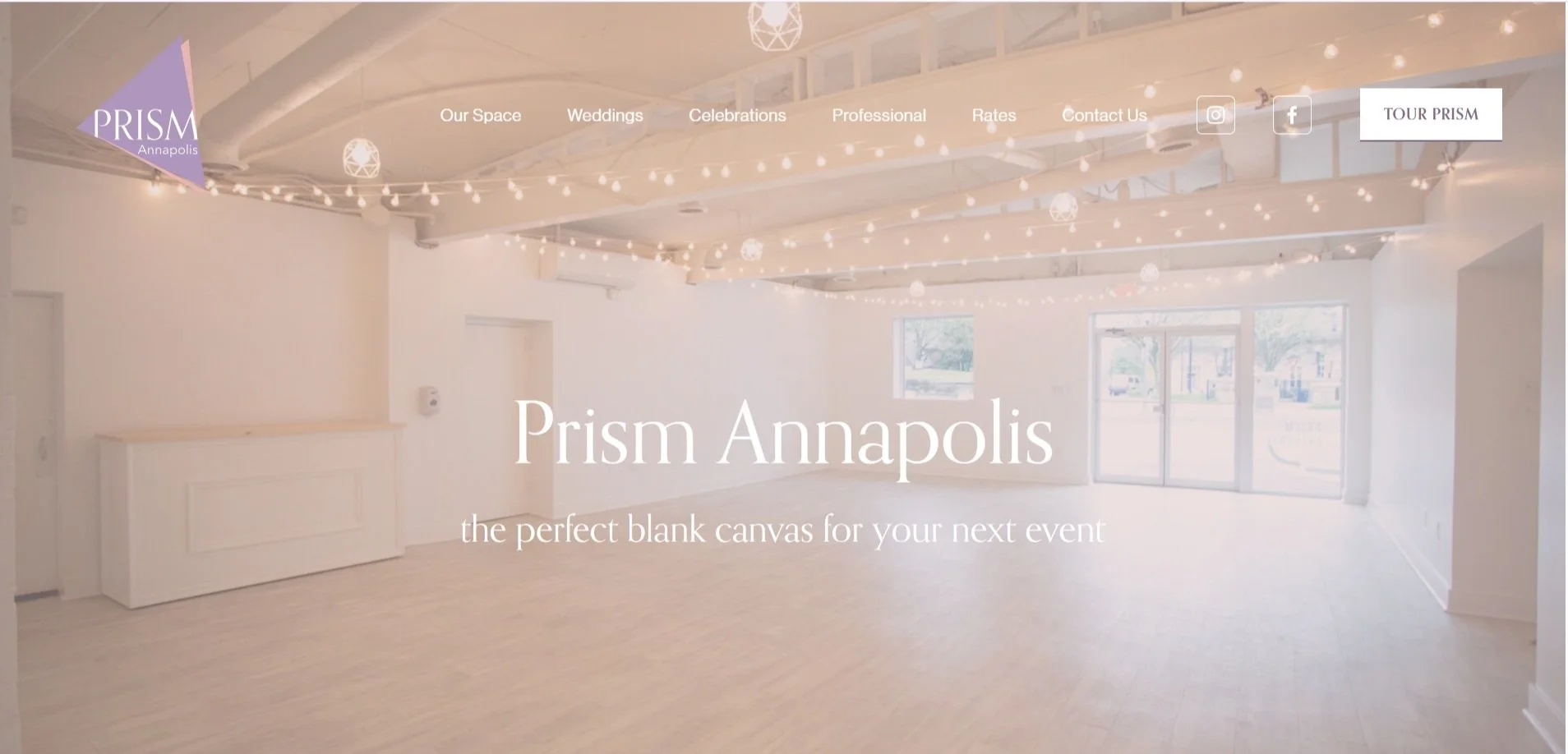 Prism Annapolis event venue homepage showing an open white loft space with string lights