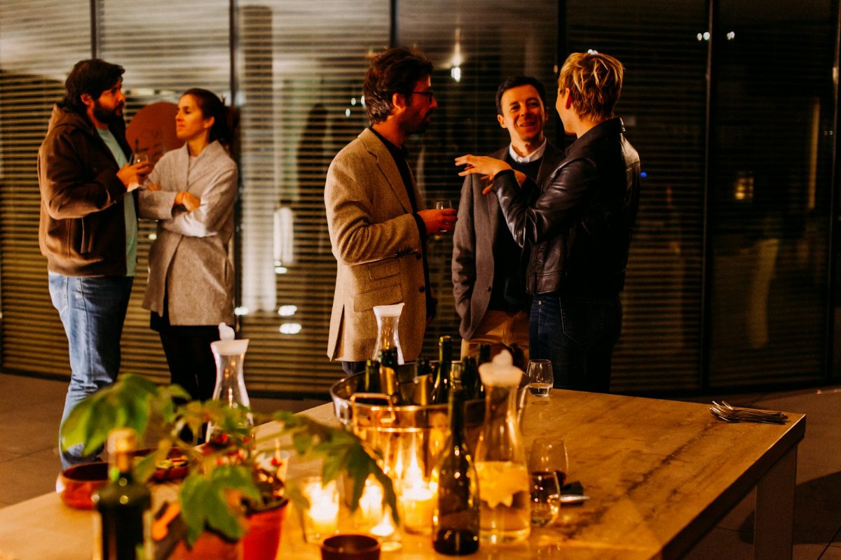 Colleagues mingling — office holiday party ideas people actually enjoy