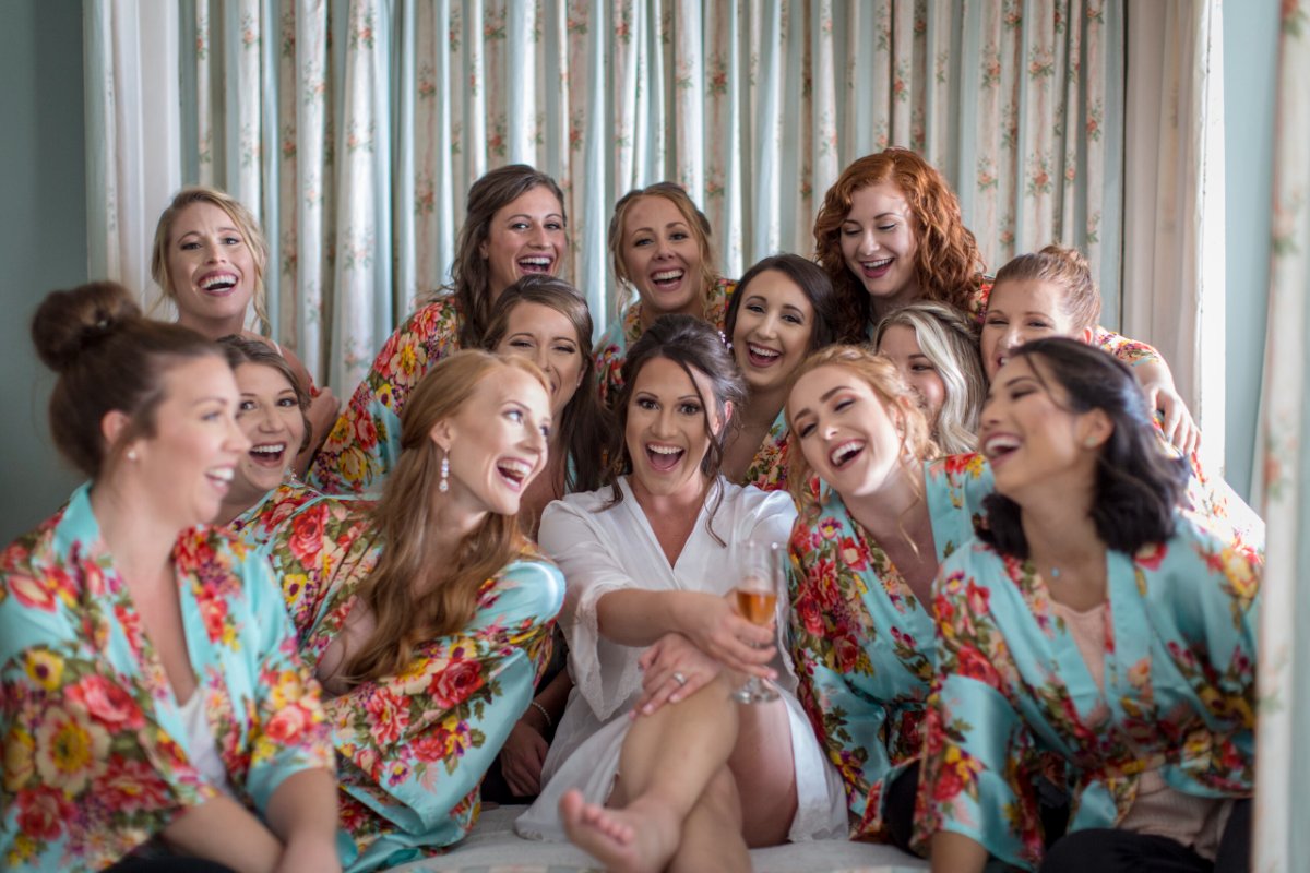 Bridesmaids in matching robes at a historic Eastern Shore manor — one of many Maryland wedding venues shaping cost in 2026
