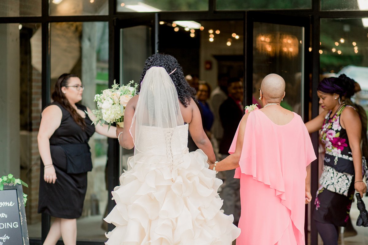 Bride walking down the aisle at an industrial-elegant ballroom wedding in Columbia, Maryland