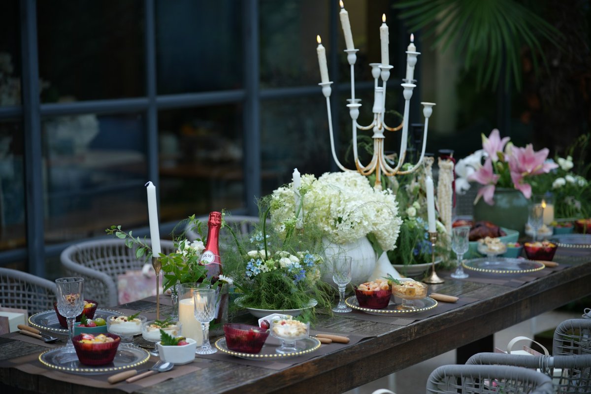 Host relaxed at a backyard party — how to host without doing everything yourself