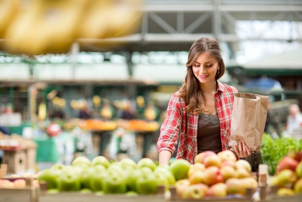 Shopping for fresh apples at a farmers market — sourcing simple cozy girls' night in ideas